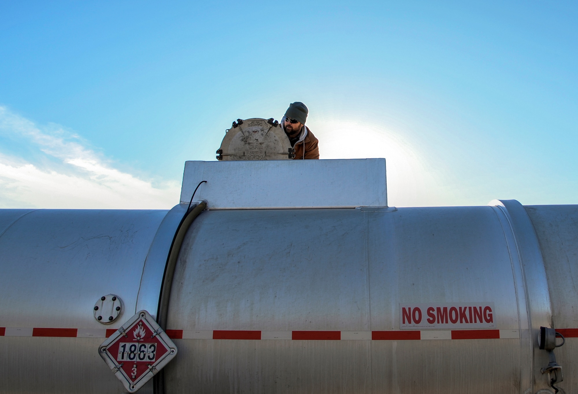 Ernie Gilmore, a 19th Logistics Readiness Squadron fuels distribution system operator, inspects a tanker truck shipment of jet fuel  Jan. 5, 2015, at Little Rock Air Force Base, Ark. Terminal technicians inspect arriving fuel tanks to ensure proper levels and look for any debris or water. (U.S. Air Force photo by Airman 1st Class Harry Brexel)