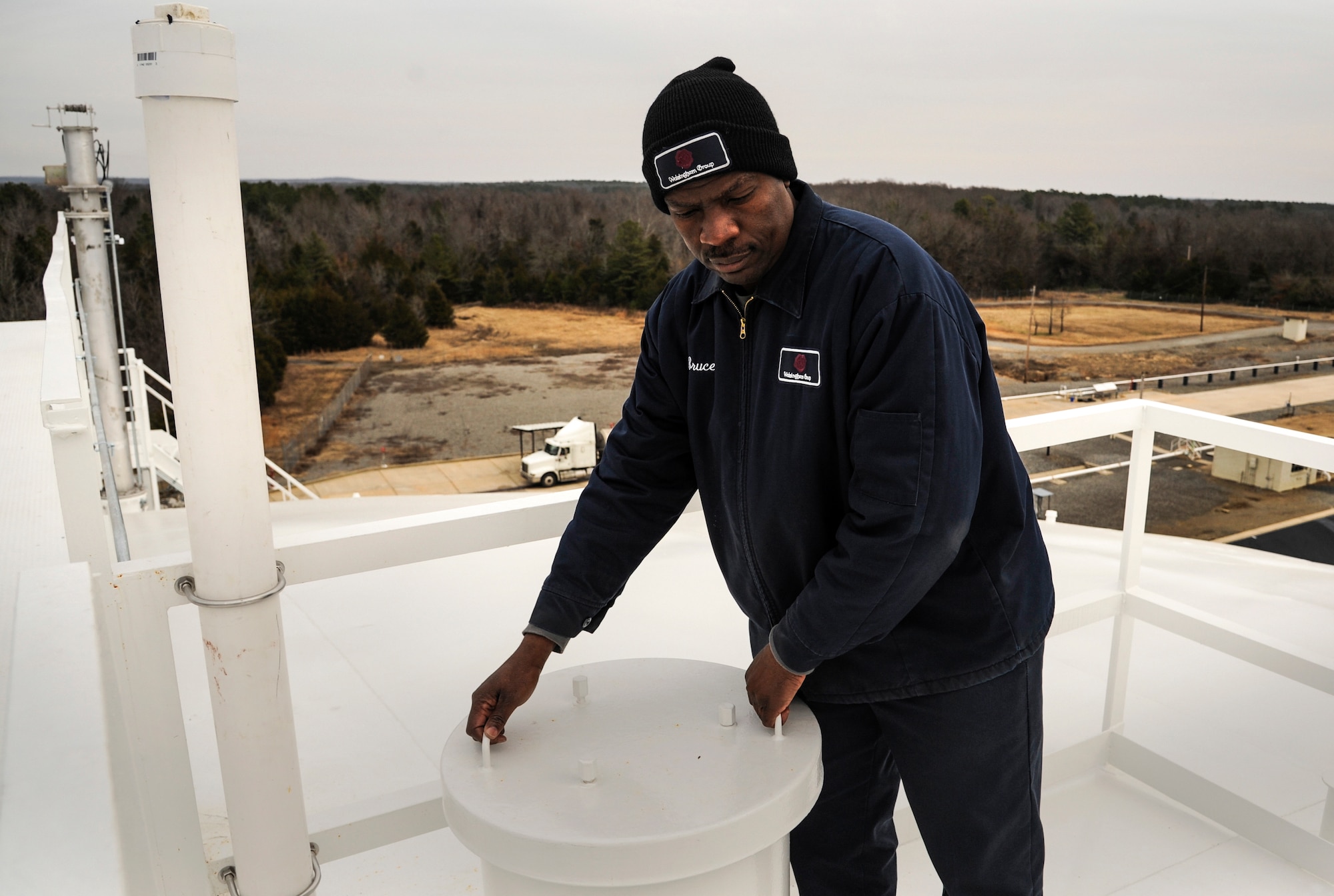 Bruce Junior, the 19th Logistics Readiness Squadron fuels terminal superintendent, secures a lid on a jet fuel storage tank Dec. 18, 2014, at Little Rock Air Force Base, Ark. Fuel tanks are routinely inspected, both electronically and manually. (U.S. Air Force photo by Airman 1st Class Harry Brexel) 