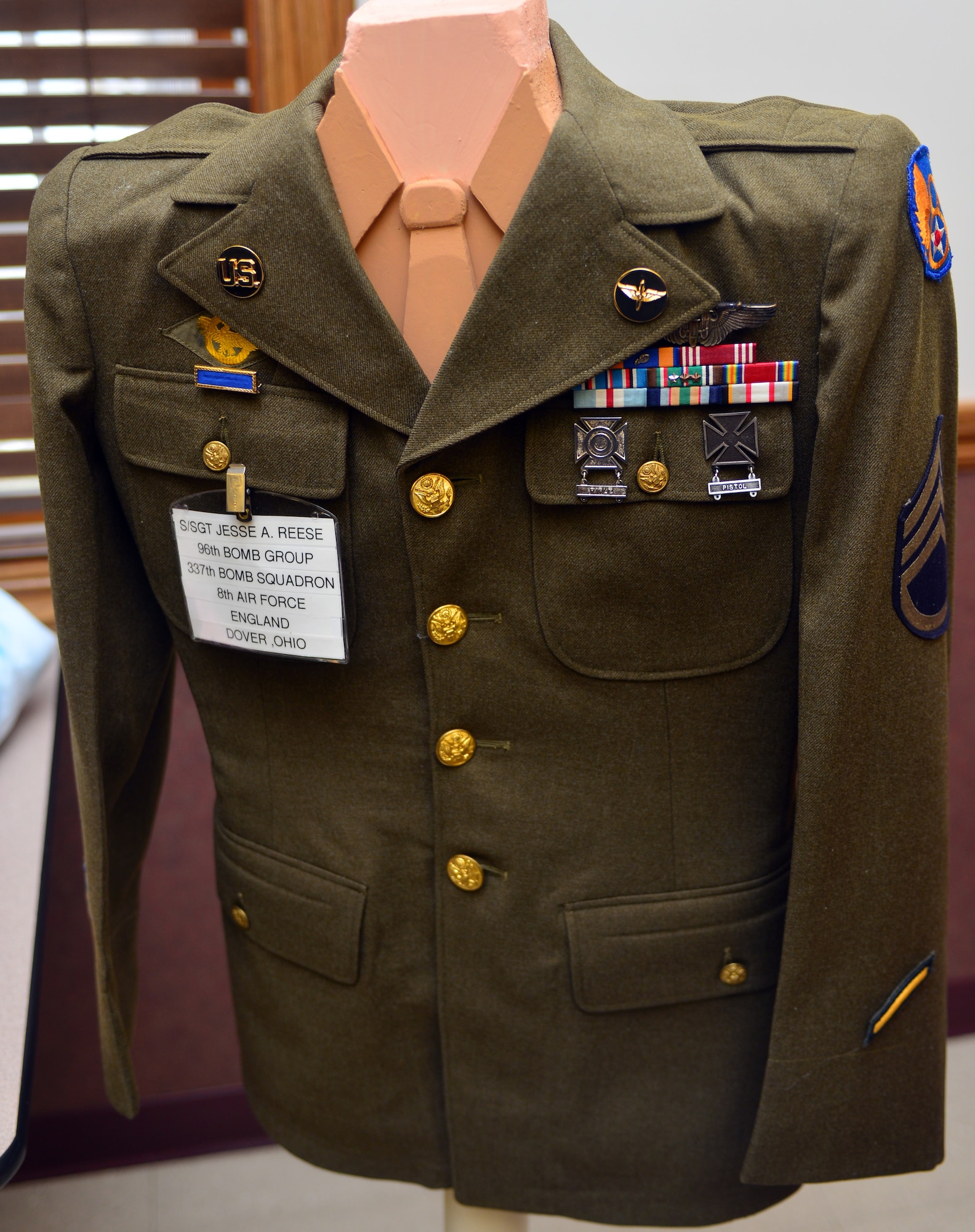 U.S. Air Force Col. Jim Jones, 121st Air Refueling Wing Commander, presents retired Staff Sgt. Jesse Reese with the Distinguished Flying Cross medal Jan. 16, 2015, in Dover, Ohio. Reese earned the medal on Dec. 31, 1944,  as a tail gunner over the skies of Hamburg, Germany. (U.S. Air National Guard photo by Master Sgt. Ralph Branson/Released)
