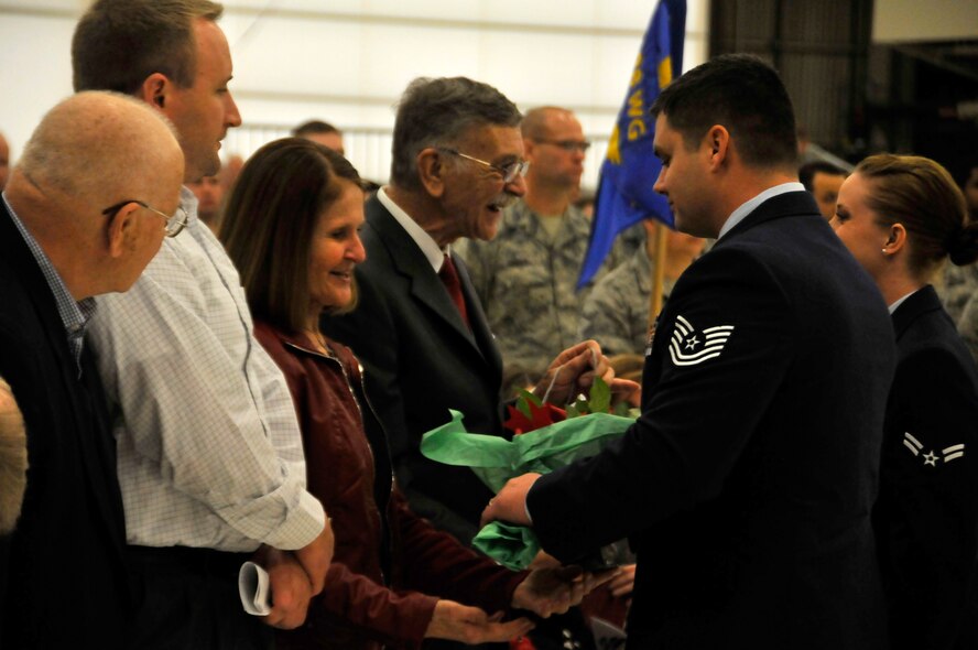 Mr. Rodney Doorenbos and Ms. Patricia Doorenbos, father and mother of the new 188th Wing commander Col. Bobbi Doorenbos, receive ceremonial gifts during a 188th Wing change of command ceremony Jan. 11 at Ebbing Air National Guard Base, Fort Smith, Ark. Col. Mark Anderson relinquished command of the 188th to Col. Bobbi Doorenbos during the ceremony. (U.S. Air National Guard photo by Staff Sgt. John Suleski/released)