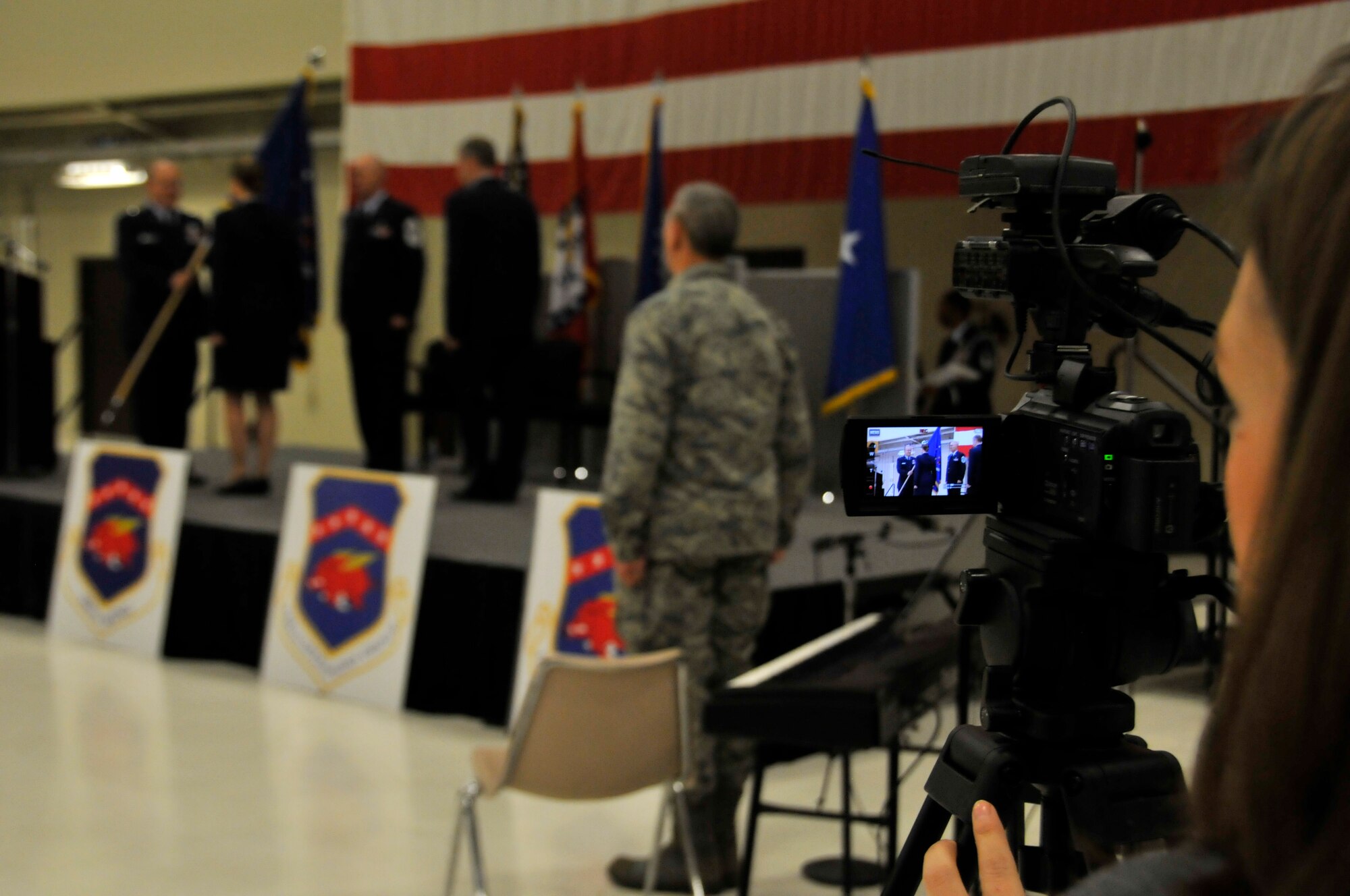 Amy Slanchik of local CBS affiliate, KFSM 5 News, captures video of the 188th Wing change of command ceremony Jan. 11 at Ebbing Air National Guard Base, Fort Smith, Ark. Col. Mark Anderson relinquished command of the 188th to Col. Bobbi Doorenbos during the ceremony. (U.S. Air National Guard photo by Staff Sgt. John Suleski/released)