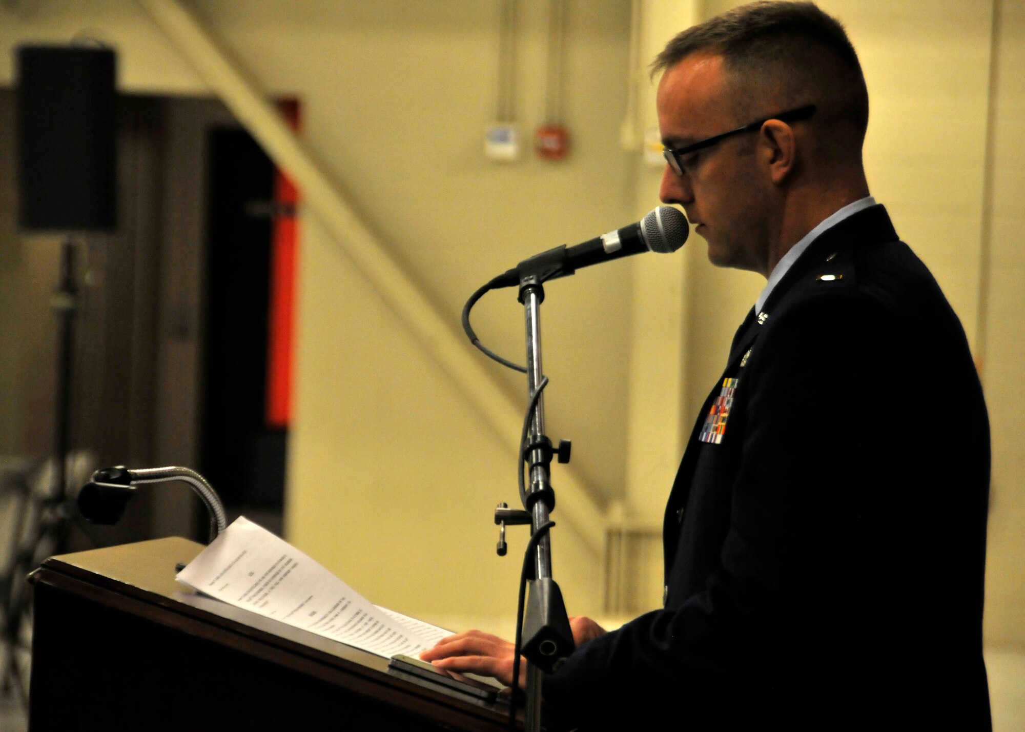 Second Lt. Bryce Cunningham of the 123rd Intelligence Squadron narrates the 188th Wing change of command ceremony Jan. 11 at Ebbing Air National Guard Base, Fort Smith, Ark. Col. Mark Anderson relinquished command of the 188th to Col. Bobbi Doorenbos during the ceremony. (U.S. Air National Guard photo by Staff Sgt. John Suleski/released)
