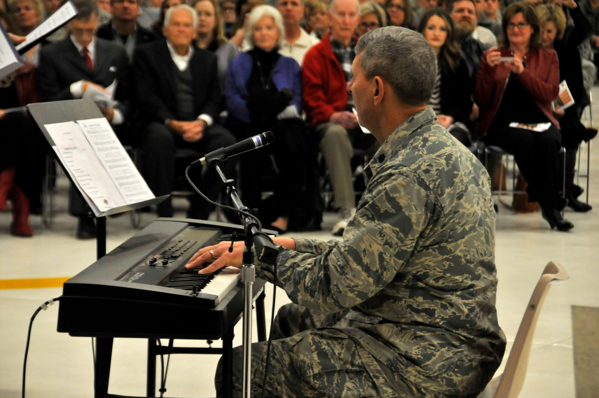 Lt. Col. Tom Smith, Arkansas National Guard chaplain, performs with the 188th Wing choir during a wing change of command ceremony Jan. 11 at Ebbing Air National Guard Base, Fort Smith, Ark. Col. Mark Anderson relinquished command of the 188th to Col. Bobbi Doorenbos during the ceremony. (U.S. Air National Guard photo by Staff Sgt. John Suleski/released)