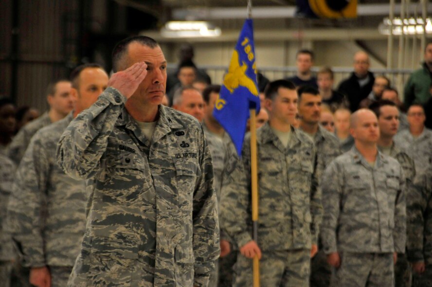 Col. Pete Gauger, 188th Wing vice commander, salutes Brig. Gen. Dwight Balch, Arkansas Air National Guard commander, during a wing change of command ceremony Jan. 11 at Ebbing Air National Guard Base, Fort Smith, Ark. Col. Mark Anderson relinquished command of the 188th to Col. Bobbi Doorenbos during the ceremony. (U.S. Air National Guard photo by Staff Sgt. John Suleski/released))