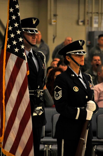 Tech Sgt. Robert Stephens, left, and Master Sgt. Jean Schnauffer, both members of the 188th Wing Honor Guard, perform during a wing change of command ceremony Jan. 11 at Ebbing Air National Guard Base, Fort Smith, Ark. Col. Mark Anderson relinquished command of the 188th to Col. Bobbi Doorenbos during the ceremony. (U.S. Air National Guard photo by Staff Sgt. John Suleski/released)