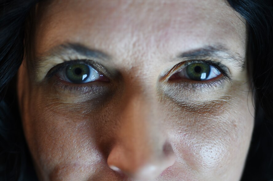 Kristina Da Silva E Silva, 423rd Medical Squadron occupational therapist, stares into her Seasonal affective disorder lamp at her office on RAF Alconbury, England, Jan. 16, 2015. The SAD lamp is a light therapy device which simulates the intake of Vitamin D the human body typically gets from natural sunlight. (U.S. Air Force photo by Staff Sgt. Jarad A. Denton/Released)