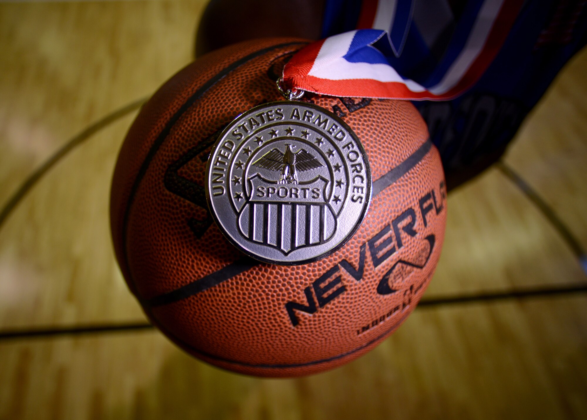 U.S. Air Force Airman 1st Class Tiara Cook, 31st Communications Squadron knowledge operator, holds her Armed Forces second place medal  Jan. 22, 2015, at Aviano Air Base, Italy.  Cook was selected to play with All Air Force and U.S. Armed Forces team for the 2014 season.  (U.S. Air Force photo by Staff Sgt. Evelyn Chavez/Released)