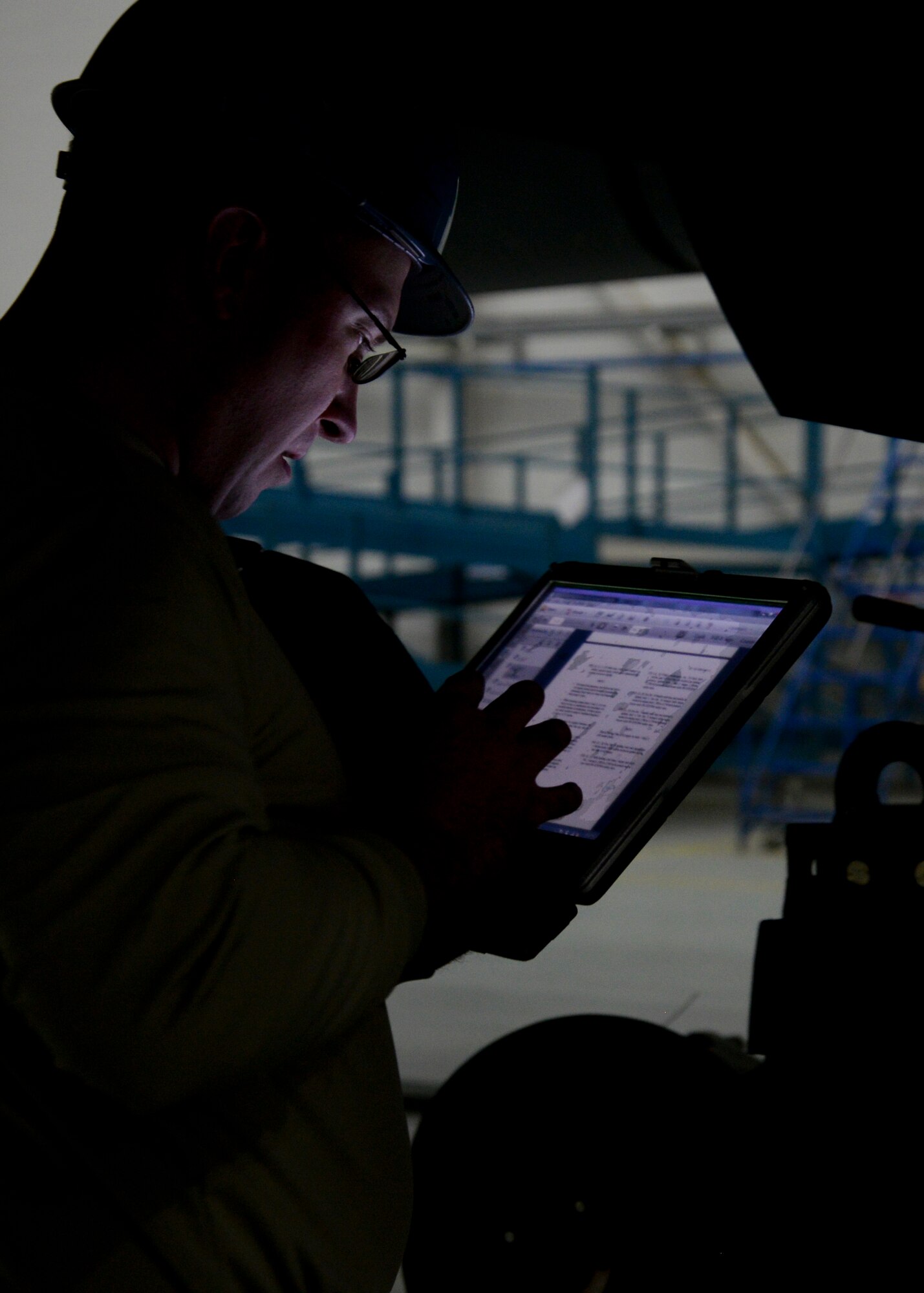 U.S. Air Force Staff Sgt. David Manning, 100th Maintenance Squadron aerospace propulsion mechanic from Poultney, Vt., reviews the steps of an engine change on a KC-135 Stratotanker Jan. 22, 2015, on RAF Mildenhall, England. Exchanging a damaged engine with an operational one on a KC-135 typically takes 48 hours to complete. (U.S. Air Force photo by Senior Airman Victoria H. Taylor/Released)