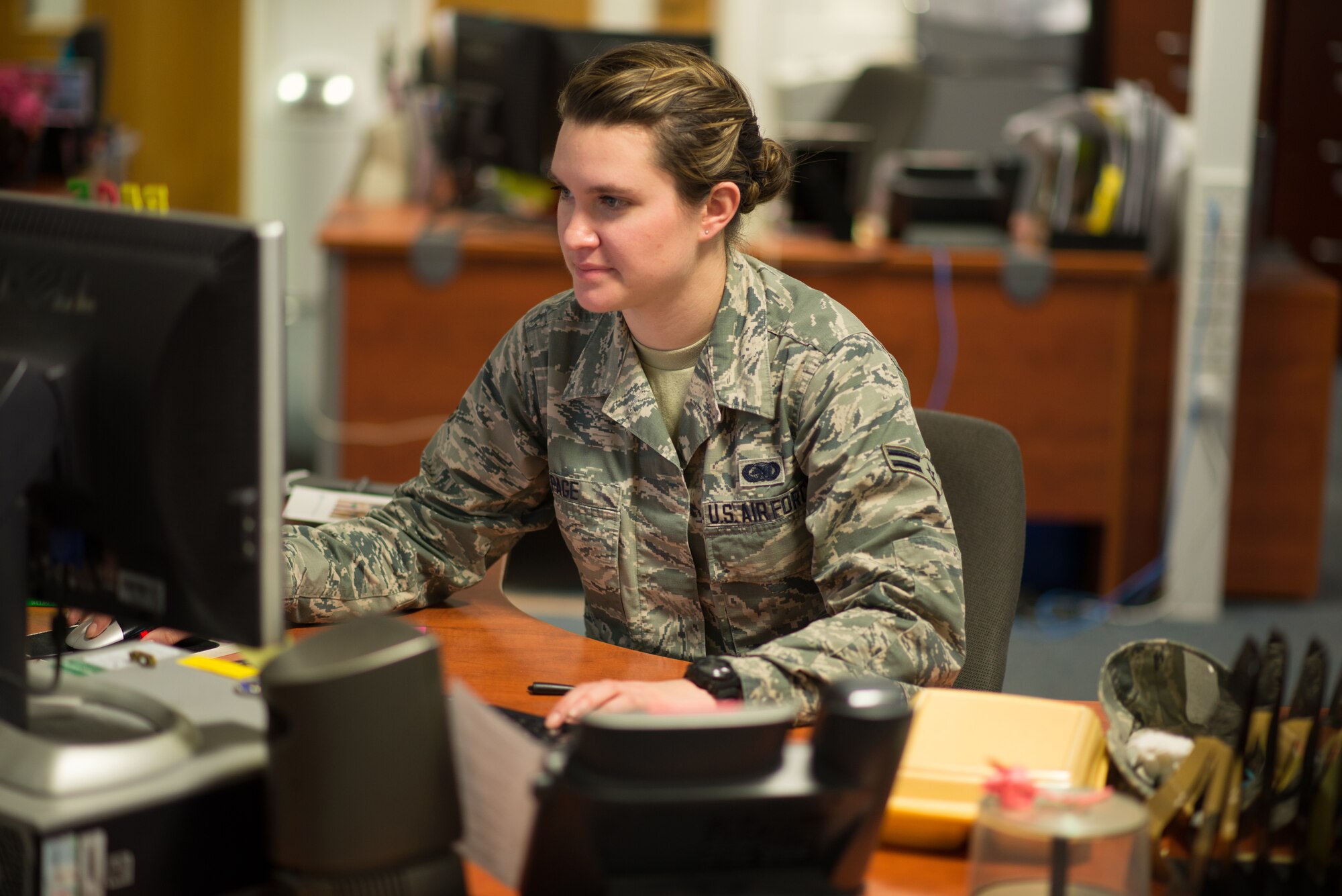 Airman 1st Class Danielle Page, 48th Logistics Readiness Squadron stock control apprentice, researches an aircraft part for a customer at Royal Air Force Lakenheath, England, Jan. 15, 2015. Page was nominated for a Liberty Spotlight because she embodies the core value of Excellence In All We Do. (U.S. Air Force photo by Senior Airman Mitchell Rose/Released)