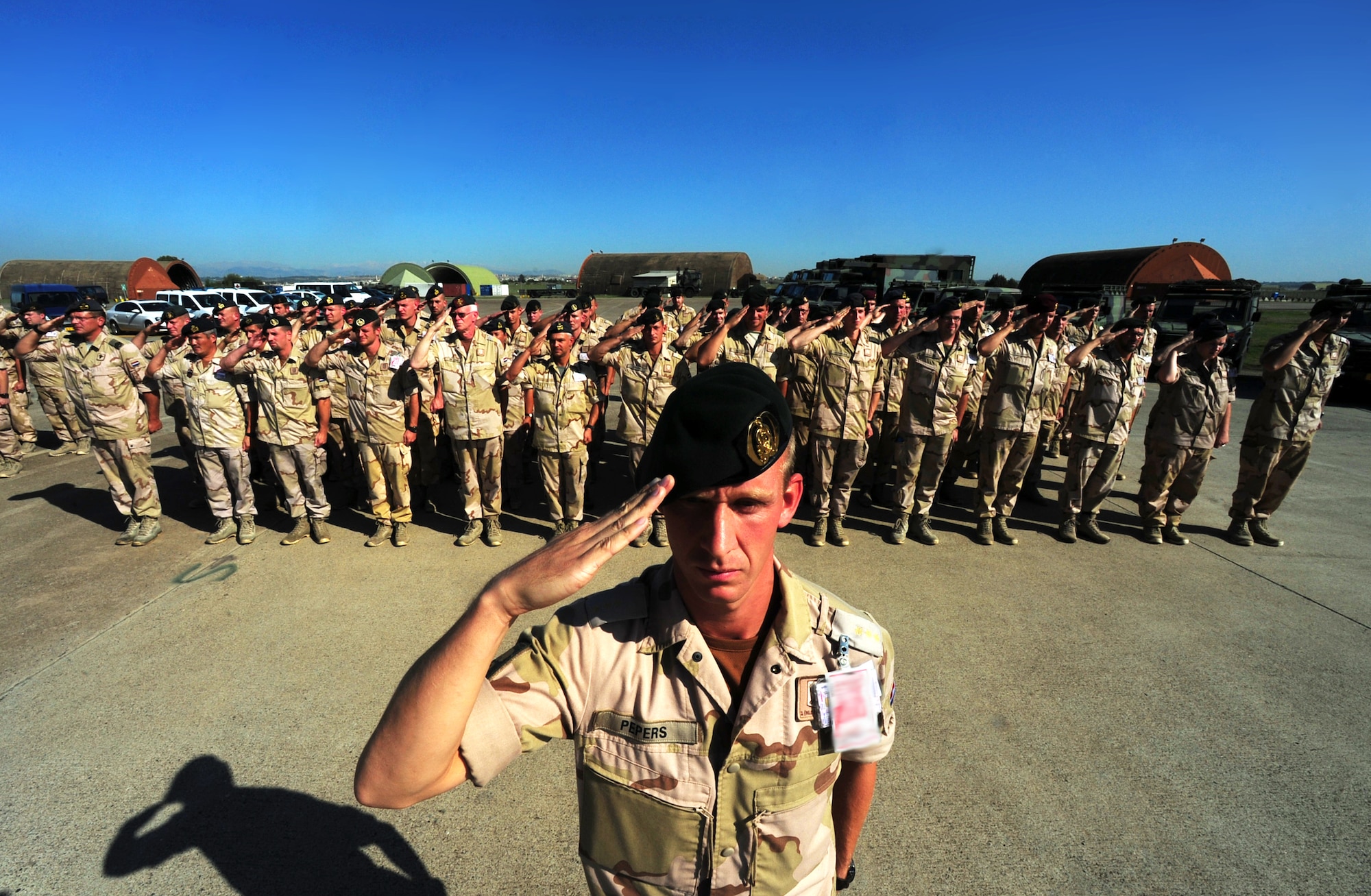 Royal Netherlands army Capt. Reijn Pepers, 1st Netherlands Ballistic Missile Defense Task Force chief of maintenance, salutes during a change of command ceremony in front of his unit Oct. 2, 2014, at Incirlik Air Base, Turkey. The Dutch forces were stationed at Incirlik AB for two years as part of the ongoing NATO mission Operation Active Fence. (U.S. Air Force photo by Senior Airman Nicole Sikorski/Released)