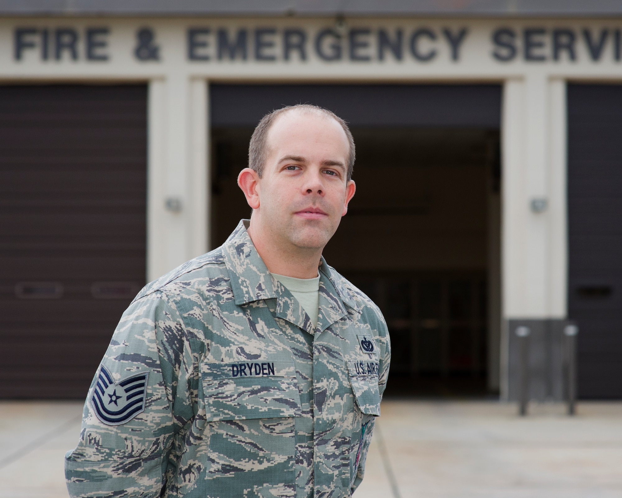 Technical Sgt. William Dryden Jr., 325th Civil Engineer Squadron Fire Department station captain/crew chief, stands in front of the Tyndall Fire Station 1 Jan. 20. Dryden helped four people get out of an overturned vehicle after a major collision on Jan. 15 in Panama City, Fla. (U.S. Air Force photo by Senior Airman Alex Echols/Released)
