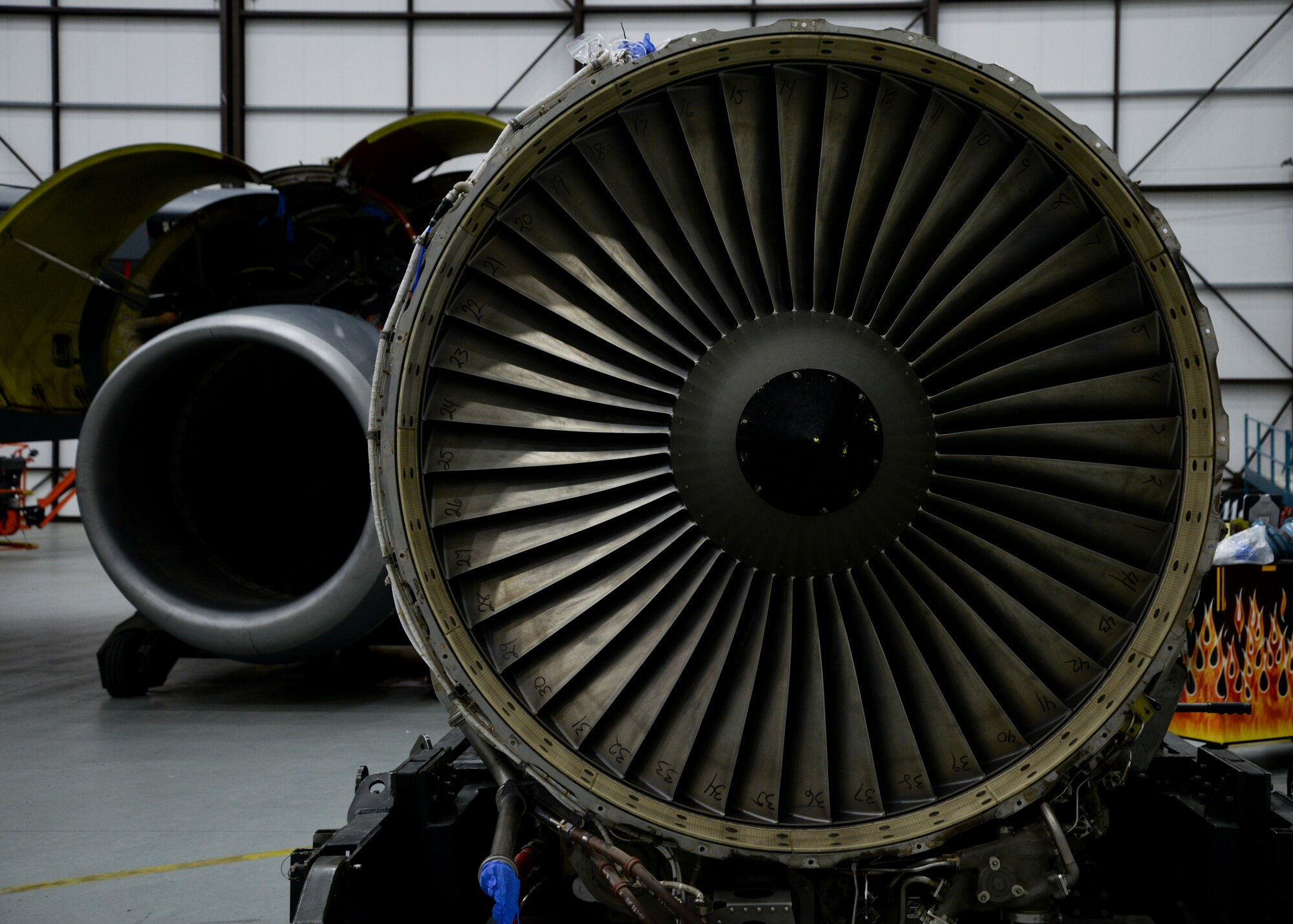 U.S. Air Force Airmen of the 100th Maintenance Squadron perform an engine swap on a KC-135 Stratotanker assigned to RAF Mildenhall, England, Jan. 22, 2015. It typically takes mechanics two days to remove the old engine and install a new one. (U.S. Air Force photo by Senior Airman Victoria H. Taylor/Released)