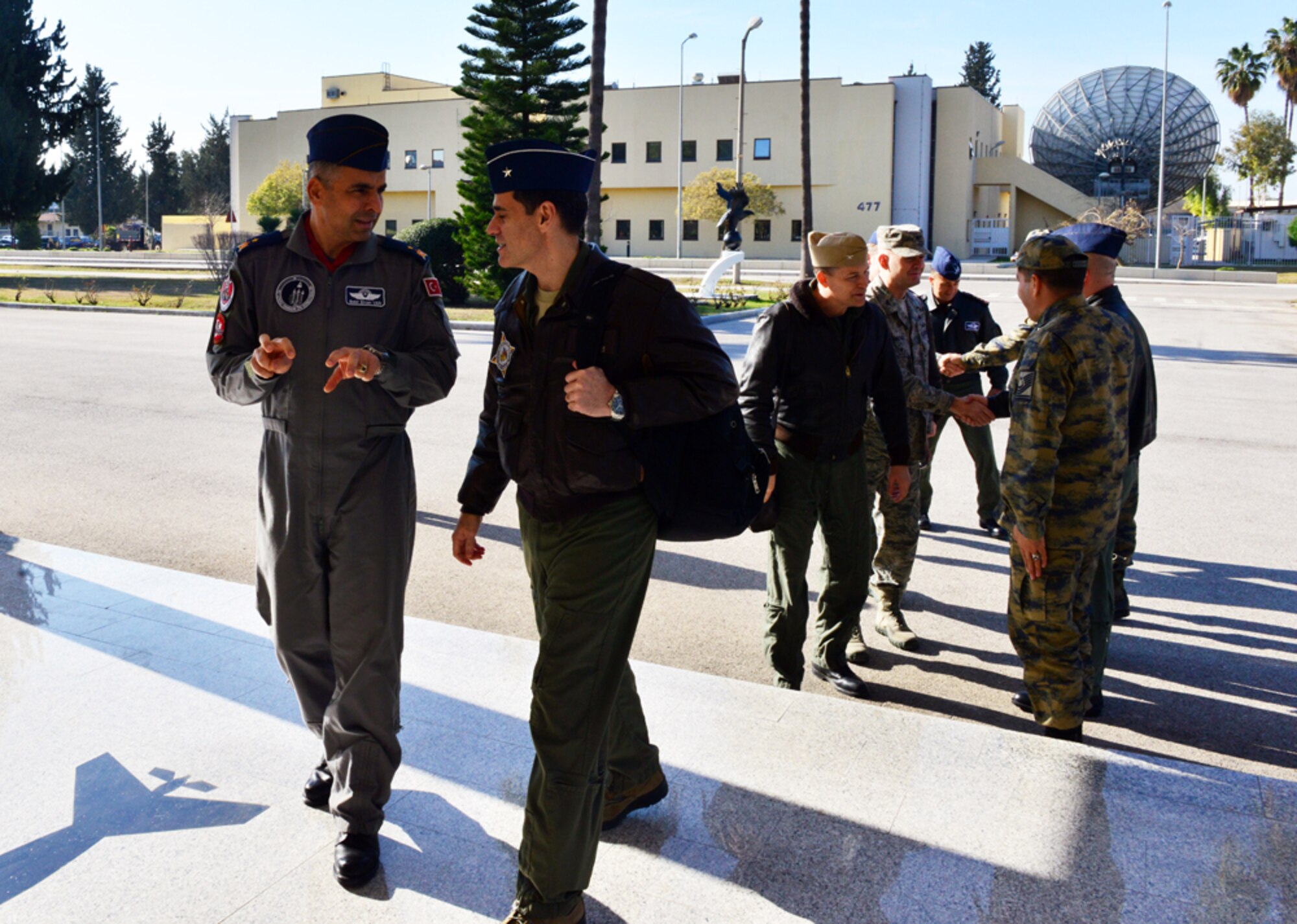 Brig. Gen. Bekir Ercan VAN, 10th Tanker Base commander, (left), talks with Brig. Gen. Marc H. Sasseville, (right), senior defense official and defense attaché, Office of Defense Cooperation Turkey, U.S. European Command, Ankara, Turkey, during a one-day base visit Jan. 20, 2015, at Incirlik Air Base, Turkey. As part of his visit, Sasseville met with 39th Air Base Wing and 10th Tanker leadership and toured key Turkish air force facilities. (U.S. Air Force photo by Senior Airman Michael Battles/Released)