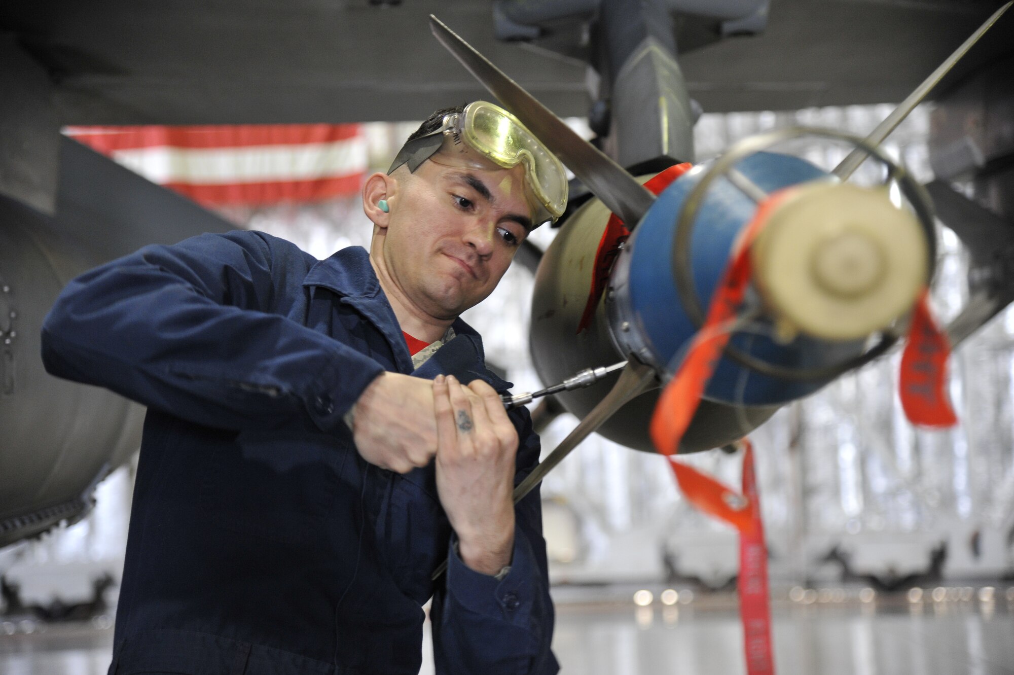 U.S. Air Force Senior Airman Juan Gonzalez, 13th Aircraft Maintenance Unit weapons loader, competes in the 35th Fighter Wing's 4th Quarter Load Crew Competition. 