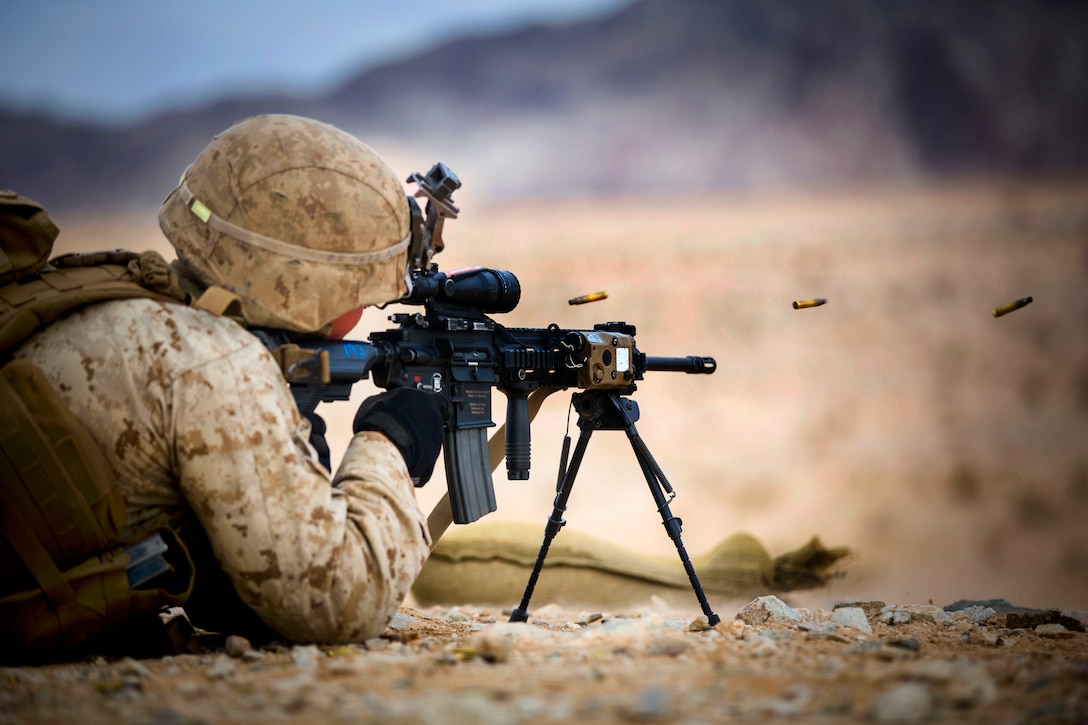 Marine Corps Lance Cpl. Dacotah E. Roskop fires the M27 Infantry Automatic Rifle down range during various courses of fire at Range 105-A on Camp Wilson, Marine Corps Air Ground Combat Center in Twentynine Palms, Calif., Jan. 20, 2015. Roskop is an automatic rifleman assigned to Fox Company, 2nd Battalion, 3rd Marine Regiment.