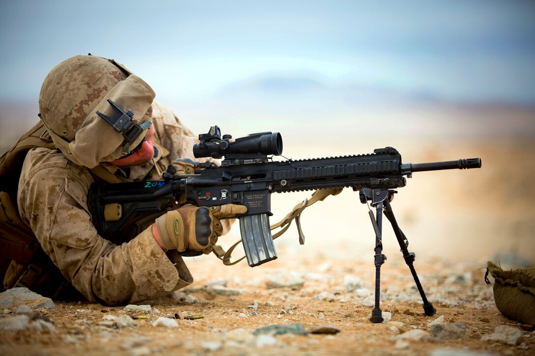 Navy Petty Officer 3rd Class Jordan A. Kopf performs immediate action on the M27 Infantry Automatic Rifle during various courses of fire at Range 105-A on Camp Wilson, Marine Corps Air Ground Combat Center in Twentynine Palms, Calif., Jan. 20, 2015. Kopf is a corpsman assigned to Fox Company, 2nd Battalion, 3rd Marine Regiment.