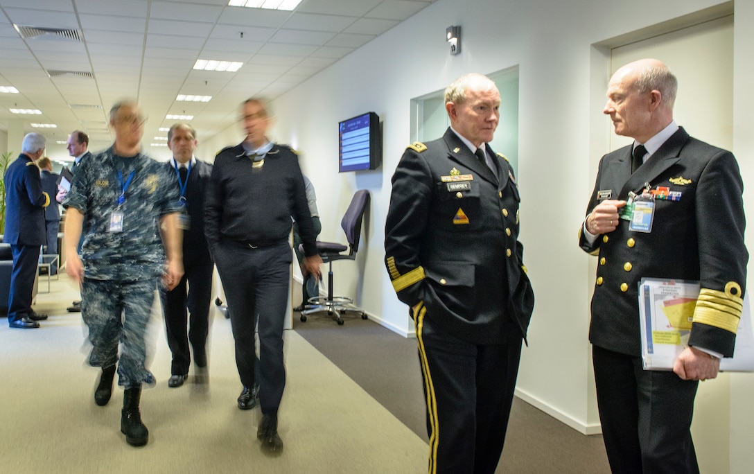 Norwegian Chief of Defense Navy Adm. Haakon Bruun-Hanssen, and U.S. Army Gen. Martin E. Dempsey, chairman of the Joint Chiefs of Staff, talk between meetings of the NATO military committee in Brussels, Jan. 22, 2015. 
