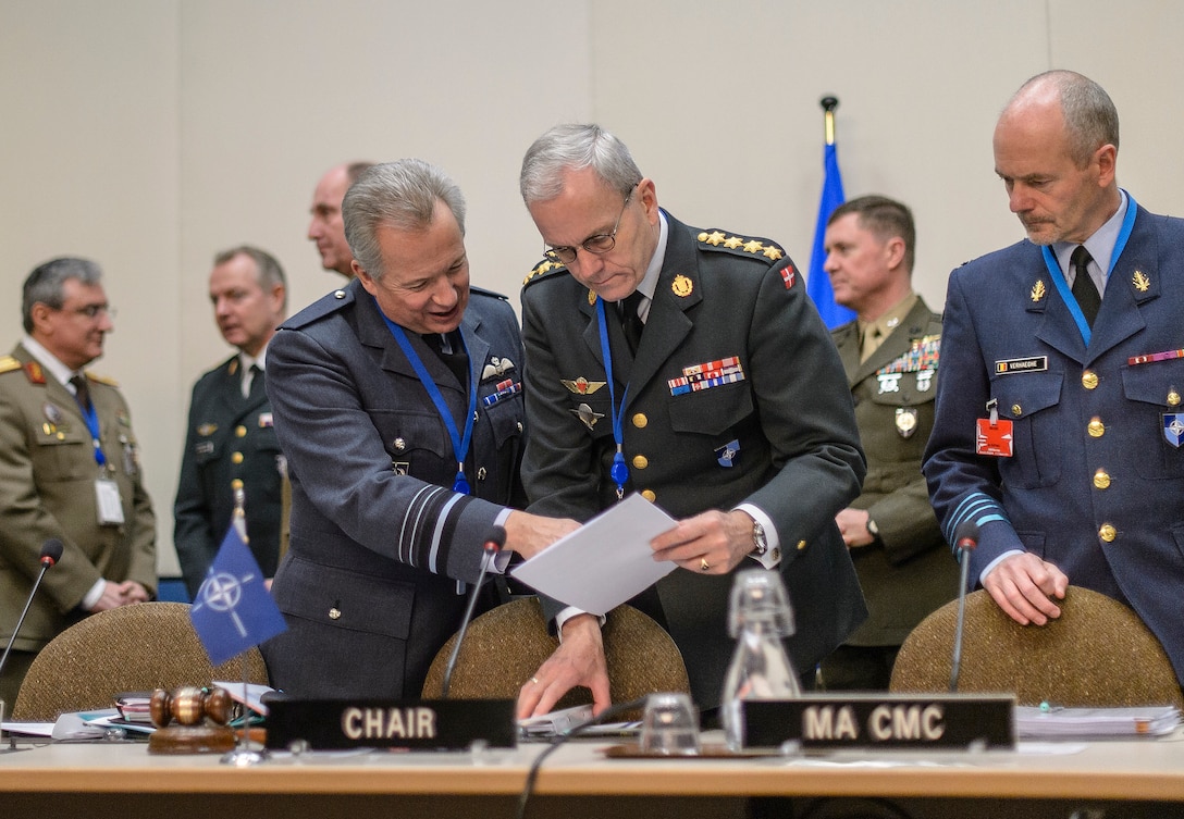Danish Gen. Knud Bartels, chairman of NATO's Military Committee, is briefed before joining a meeting of the NATO Chiefs of Defense in Brussels, Jan. 22, 2015. 