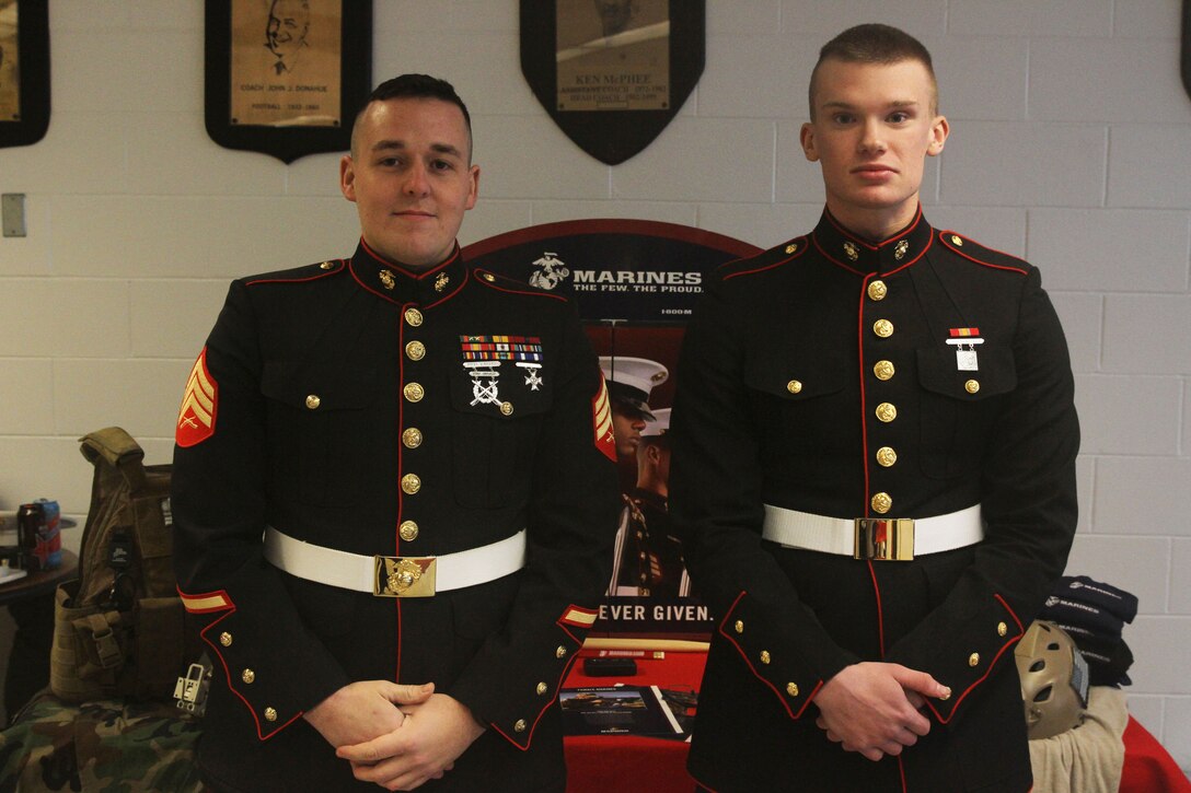 Sgt. Michael Godjikian stands with Pvt. Pavlo Sinkevych at a recruiting table setup during a Junior Reserve Officers’ Training Corps drill competition at Quincy High School, Quincy, Massachusetts, Dec. 20. Sinkevych was Godjikian’s first enlistment contract written as a recruiter. During Godjikian’s short time as a recruiter, he has already set himself apart from his peers by being a standout Marine ambassador in his schools and community. Godjikian has won recruiter of the month, recruiter of the quarter and is currently nominated for recruiter of the year. Godjikian is a recruiter for Recruiting Substation North Boston.