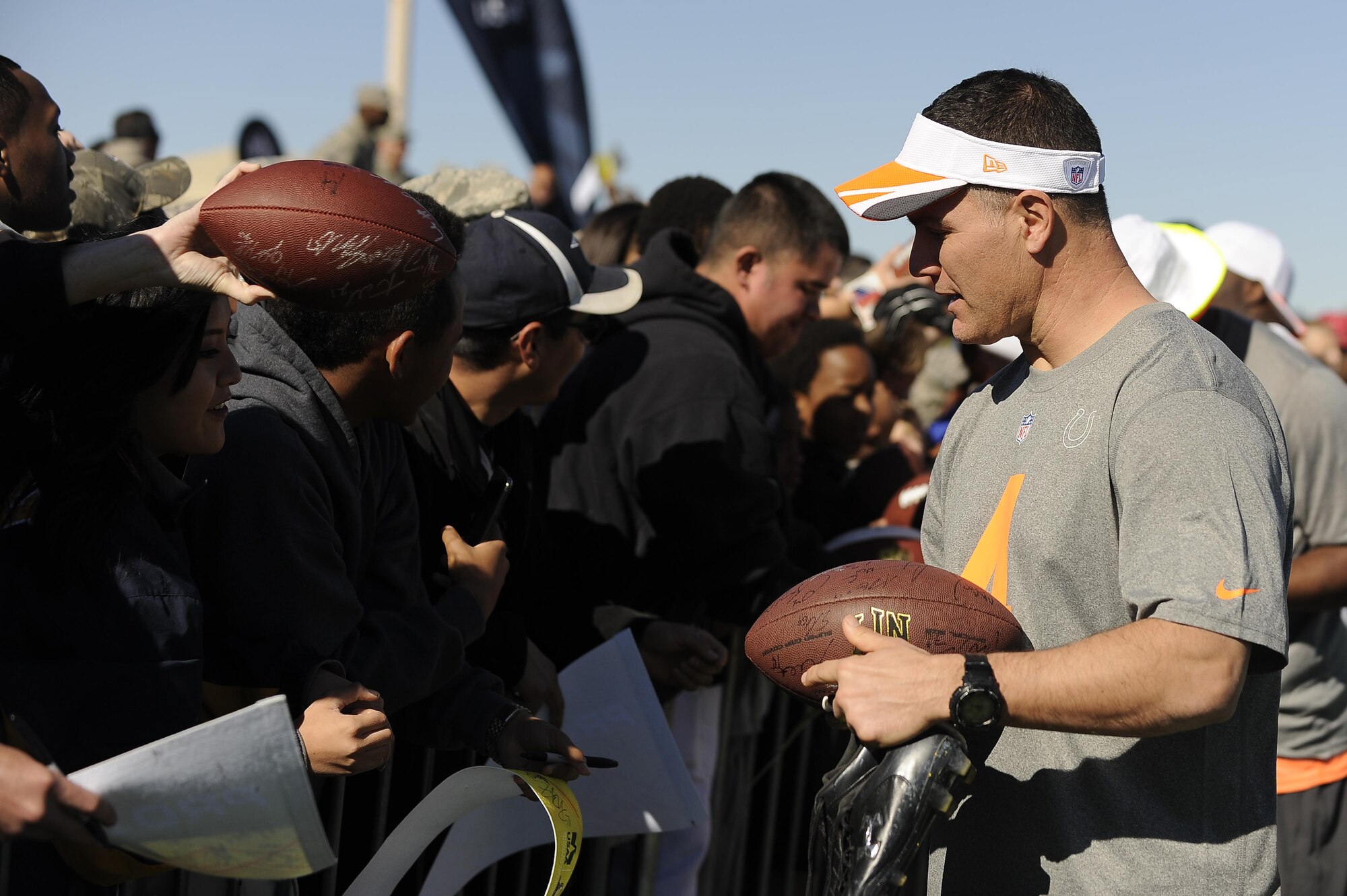 Adam Vinatieri, Indianapolis Colts placekicker assigned to Team Irvin, talks with Airmen and their families after the Pro Bowl practice held at Luke Air Force Base, Arizona, Jan. 22, 2015. Vinatieri was among several Pro Bowl players to come out to Luke to practice for the game this Sunday and to show support for Airmen. (U.S. Air Force photo by Staff Sgt. Staci Miller)