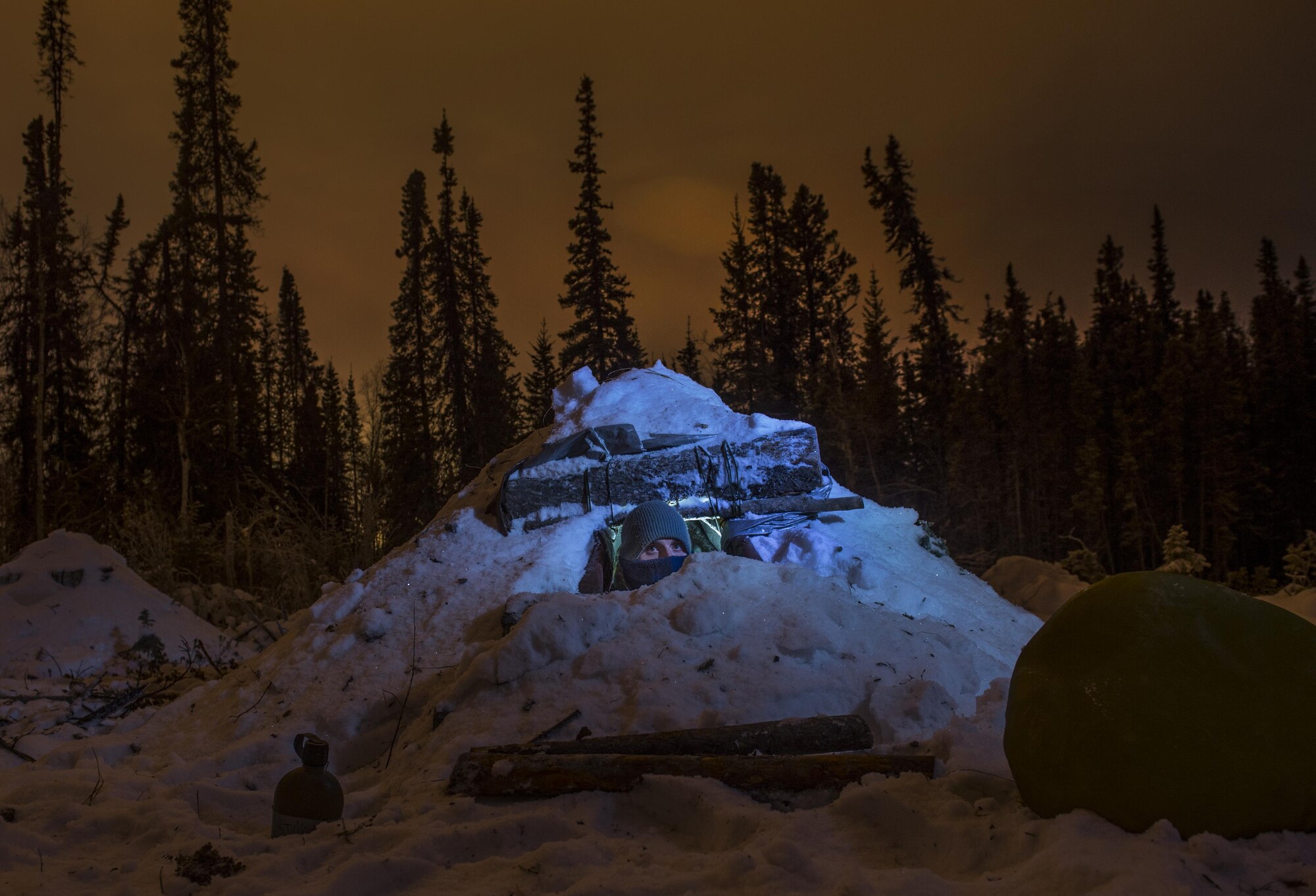 Airman 1st Class Ray Simon  looks out of his thermalized A-frame tent during arctic survival school Jan. 15, 2015, near Eielson Air Force Base, Alaska. The thermalized A-frame is designed to keep survivors warm and dry in arctic environments. Simon is a 3rd Maintenance Support Squadron crew chief. The story about Arctic Survival School will be published in the February issue of Airman magazine. To find out more information or to read other Airman stories, visit http://airman.dodlive.mil.  (U.S. Air Force photo/Staff Sgt. Vernon Young Jr.)