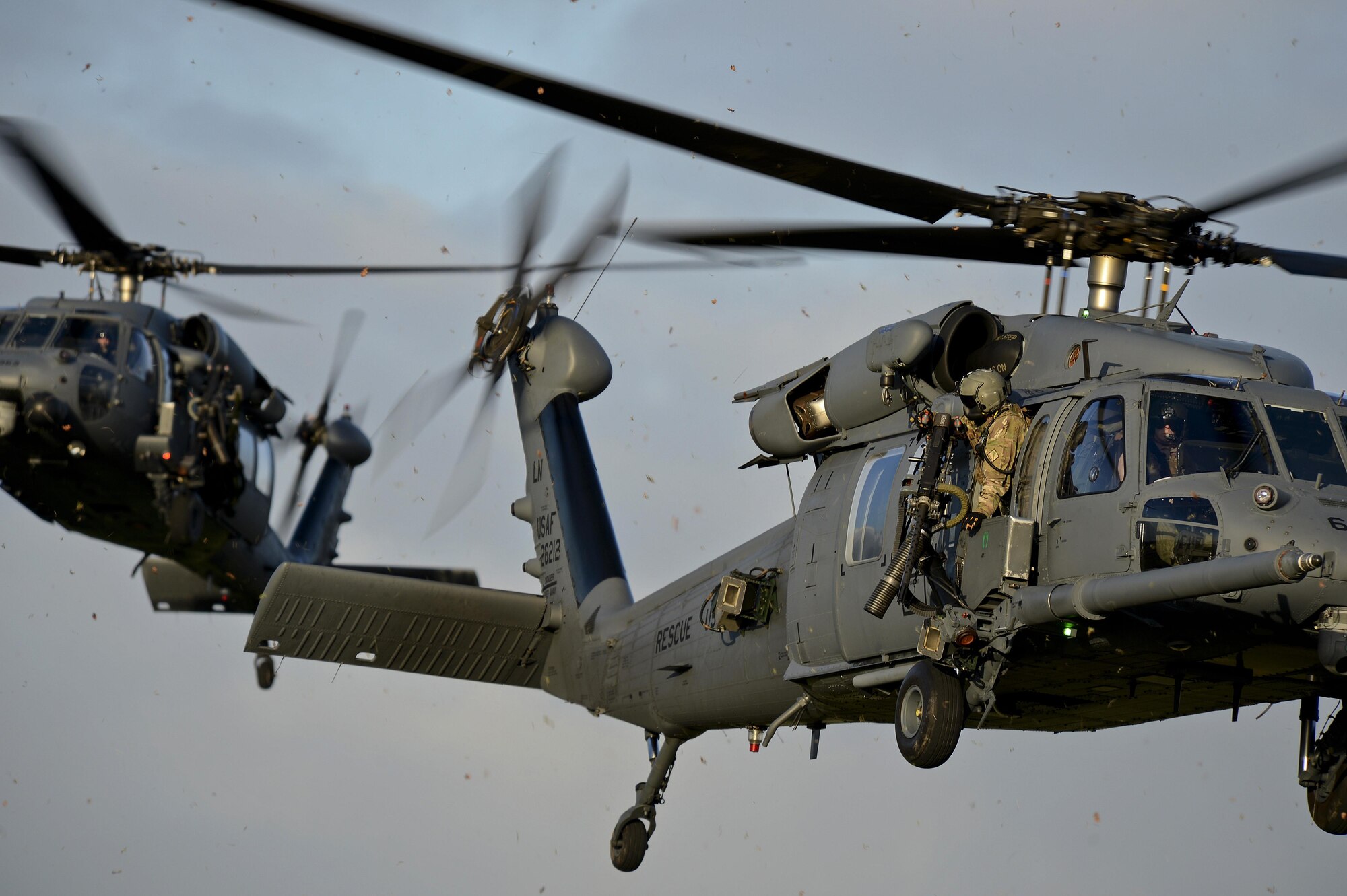 Two 56th Rescue Squadron HH-60G Pave Hawks respond in a combat search and rescue scenario Jan. 16, 2015, on Royal Air Force Lakenheath, England. Unlike other rescue squadrons, the 56th RQS is the only unit with a dedicated combat search and rescue force to conduct personnel recovery for a joint force. (U.S. Air Force photo/Airman 1st Class Trevor T. McBride)