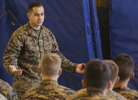 Sergeant Franklin Ramos, a motor transportation licensing noncommissioned officer with the U.S. Marine Corps Mountain Warfare Training Center, teaches Marines the basics of the small unit support vehicles during classroom instruction aboard Bridgeport, California, Jan. 14, 2015. He explained how the SUSV and the high mobility multipurpose wheeled vehicles react to different terrain, and how to use them to their advantage. (U.S. Marine Corps photo by Lance Cpl. Kaitlyn Klein/released)