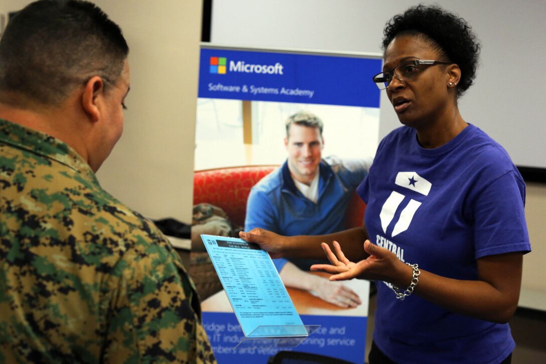 Michelle Howard, right, shares information about some of the education opportunities that are available to Marines during a Transition Resource Fair held, here, by the Personal and Professional Development Branch of Marine and Family Programs Jan. 22.

Howard is a graduation coordinator with Central Texas College at the Joint Education Center here.