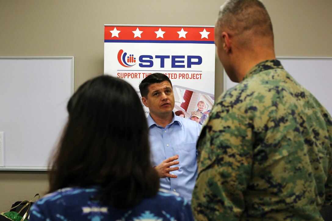 Steve McClelland, center, shares information about the services Support The Enlisted Project offers Marines who are transitioning our of the military during a Transition Resource Fair held, here, by the Personal and Professional Development Branch of Marine and Family Programs Jan. 22.

McClelland is a communications manager with STEP.