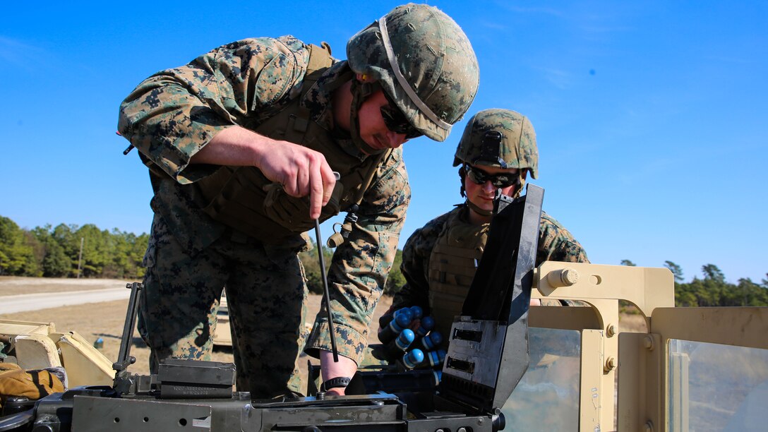 Cpl. Nicholas Lemieux, a section leader with Scout Platoon, 2nd Tank Battalion, clears a Mk 19 automatic grenade launcher of any residual links during an annual qualification at training area G-7 aboard Camp Lejeune, N.C., Jan. 21, 2015. As a section leader, Lemieux ensured the safety of his Marines as they fired the weapon. 