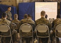 Marines with 2nd Battalion, 6th Marine Regiment, and Combat Logistics Battalion 26, Headquarters Regiment, 2nd Marine Logistics Group, learn small unit support vehicle and mountain driving during classroom instruction aboard Bridgeport, California, Jan. 14, 2015. The Marines learned the advantages and disadvantages of high mobility multipurpose wheeled vehicles and SUSV’s based on their capabilities when faced with mountainous terrain. (U.S. Marine Corps photo by Lance Cpl. Kaitlyn Klein/released)