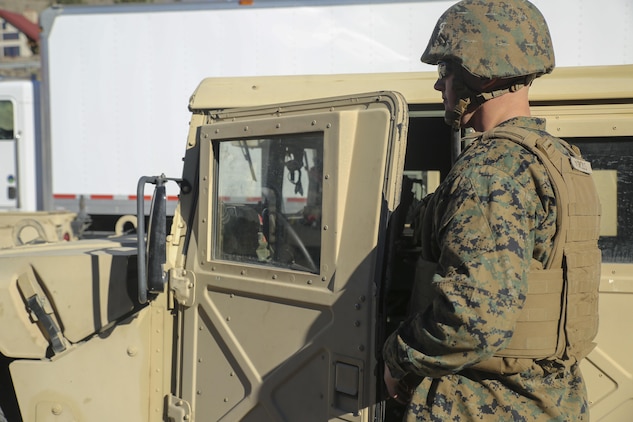 Lance Cpl. Brady Gross, a motor transportation operator with Combat Logistics Battalion 26, Headquarters Regiment, 2nd Marine Logistics Group, prepares for a convoy in the trails throughout the hills aboard Bridgeport, California, Jan. 14, 2015. The Marines practiced driving in the unfamiliar terrain to become better acquainted with the mountains they face in upcoming training. (U.S. Marine Corps photo by Lance Cpl. Kaitlyn Klein/released)