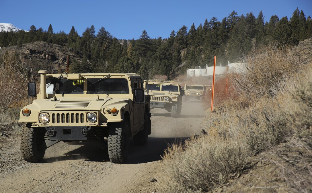 Motor Transport Marines with 2nd Battalion, 6th Marine Regiment, and Combat Logistics Battalion 26, Headquarters Regiment, 2nd Marine Logistics Group, conduct a simulated convoy throughout the hills aboard Bridgeport, California, Jan. 14, 2015. The Marines learned how to operate the High Mobility Multipurpose Wheeled Vehicles and the small unit support vehicles in mountainous terrain during classroom instruction and practical application. (U.S. Marine Corps photo by Lance Cpl. Kaitlyn Klein/released)