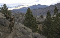 Marines with Headquarters and Service Company, Combat Logistics Battalion 26, Headquarters Regiment, 2nd Marine Logistics Group, hike roughly seven miles on the mountain trails of Bridgeport, California, Jan. 12, 2015. The Marines work towards a higher level of performance in mobility and sustainment in mountainous, high altitude, and cold weather environments. (U.S. Marine Corps photo by Lance Cpl. Kaitlyn Klein)