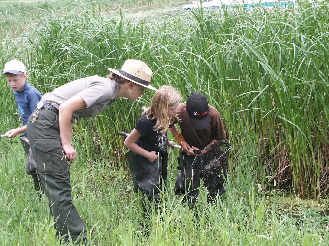 Tammy Johnson, St. Paul District park ranger, explores nature with kids during an interpretive program.