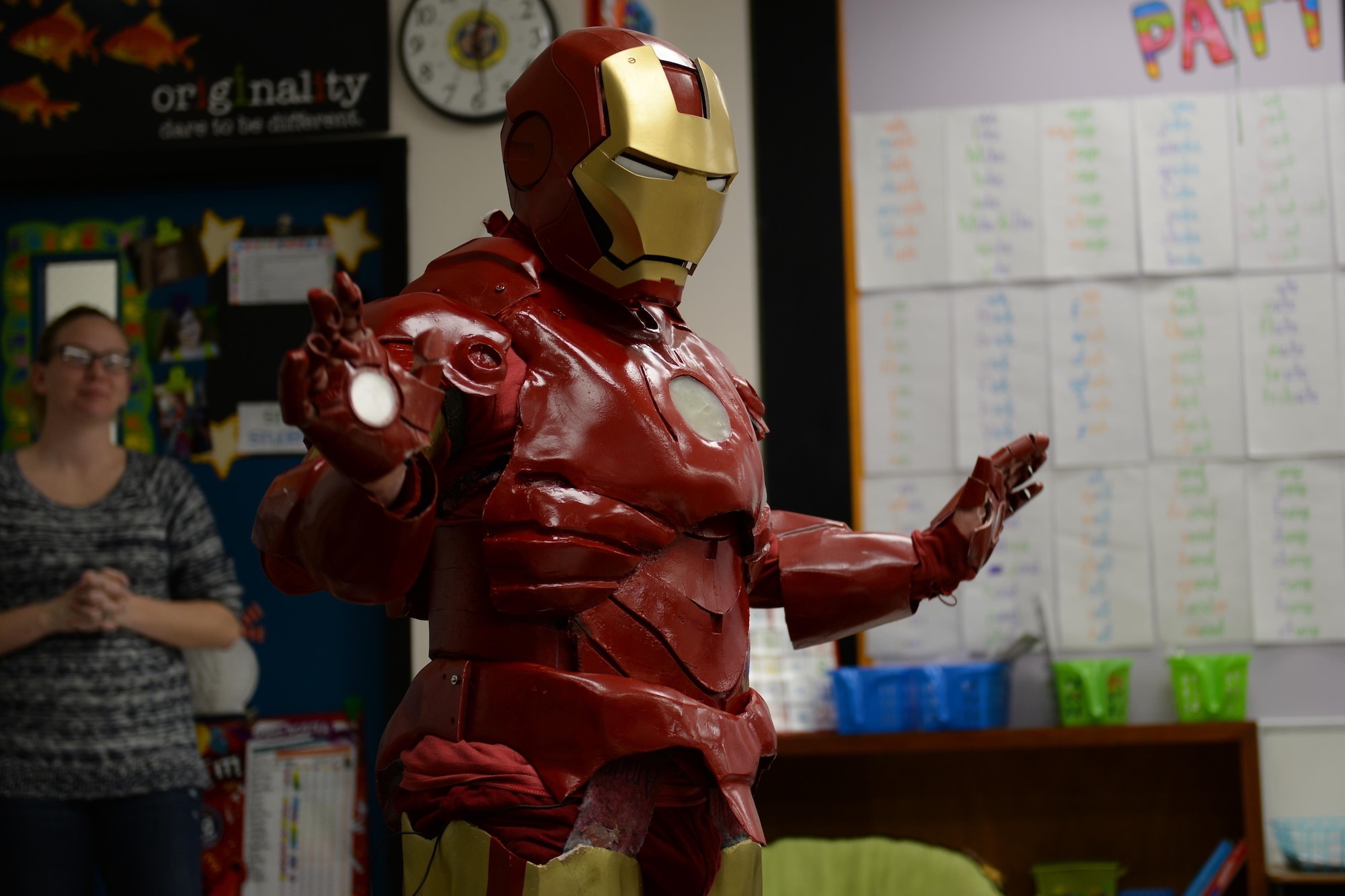 Tech. Sgt. Brian Thornton in his homemade Iron Man suit, visits a classroom at Marrington Elementary Dec. 8, 2014, on Joint Base Charleston - Weapons Station, S.C. Thornton wears his Iron Man suit to local schools and hospitals hoping to help brighten children’s days. Thornton is 628th Air Base Wing Air Defense Council paralegal. (U.S. Air Force photo/Senior Airman Christopher Reel)