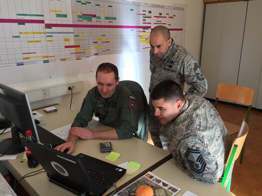 Slovenian air force Capt. Gregor Virant (left) develops airspace procedures which allow aircraft to land during inclement weather with help from Chief Master Sgt. Luis Martinez and Senior Master Sgt. Bobby Hickman  Jan. 13, 2015, at Cerklje Air Base, Slovenia. The five-day mission supported U. S. Air Forces in Europe and Air Forces Africa’s efforts to assist the Slovenian air force in developing control measures for takeoff and landing procedures during instrument flight rules conditions, giving the base the capability to conduct flights is inclement weather conditions. Virant is the 15th Wing chief of air operations. Martinez is the USAFE - AFAFRICA operations superintendent for command and control. Hickman is the 31st Operational Support Squadron chief controller.  (U.S. Air Force photo/Maj. John C. Sherinian)
