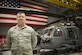 Tech. Sgt. Justin Mahana poses in front of an HH-60G Pave Hawk Jan. 20, 2015, at Nellis Air Force Base, Nev. On Jan. 6, 2015, Mahana pulled a middle-aged woman from a burning vehicle after overhearing her crash her SUV in a single-car accident in Lake Havasu, Ariz. Mahana is the 823rd Maintenance Squadron support section chief. (U.S. Air Force photo/Staff Sgt. Siuta B. Ika)
