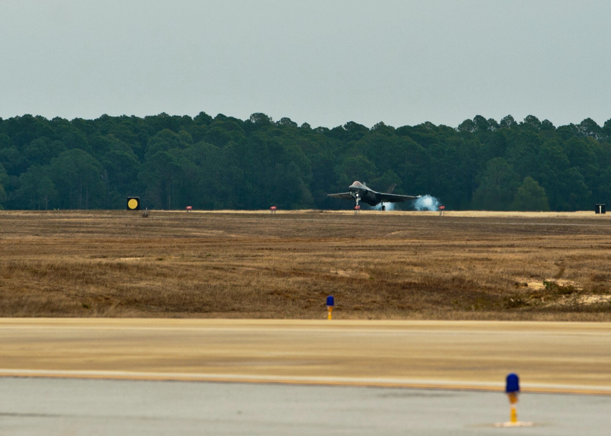 The first U.S. Marine Corps F-35C Lightning II carrier variant, flown by U.S. Marine Lt. Col. J.T. “Tank” Ryan, Marine Fighter Attack Training Squadron 501 detachment commander and F-35 pilot, lands on Eglin Air Force Base, Fla., Jan. 13, 2015. Ryan flew the aircraft from the Lockheed Martin plant, Fort Worth, Texas, as the first of five Marine Corps F-35C model aircraft to be delivered to the Navy Fighter Attack Squadron 101. The F-35C model brings 25% more range and a bigger weapons bay.  It also allows the Marine Corps to fly aboard Navy aircraft carriers, which continues an effective and long-standing tactical air integration program between the Navy and Marine Corps. (U.S. Air Force photo/Staff Sgt. Marleah Robertson)