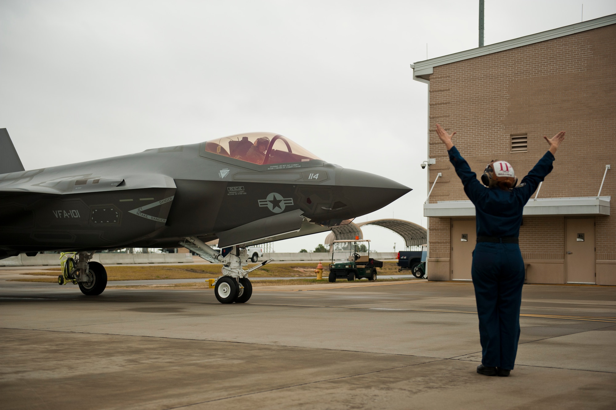 U.S. Marine Lt. Col. J.T. “Tank” Ryan, Marine Fighter Attack Training Squadron 501 detachment commander and F-35 pilot, delivers the first Marine Corps F-35C Lightning II carrier variant to Navy Attack Fighter Squadron 101 on Eglin Air Force Base, Fla., Jan. 13, 2015. Ryan flew the aircraft from the Lockheed Martin plant, Fort Worth, Texas, as the first of five Marine Corps F-35C model aircraft to be delivered to the VFA-101. The F-35C model brings 25% more range and a bigger weapons bay.  It also allows the Marine Corps to fly aboard Navy aircraft carriers, which continues an effective and long-standing tactical air integration program between the Navy and Marine Corps. (U.S. Air Force photo/Staff Sgt. Marleah Robertson)