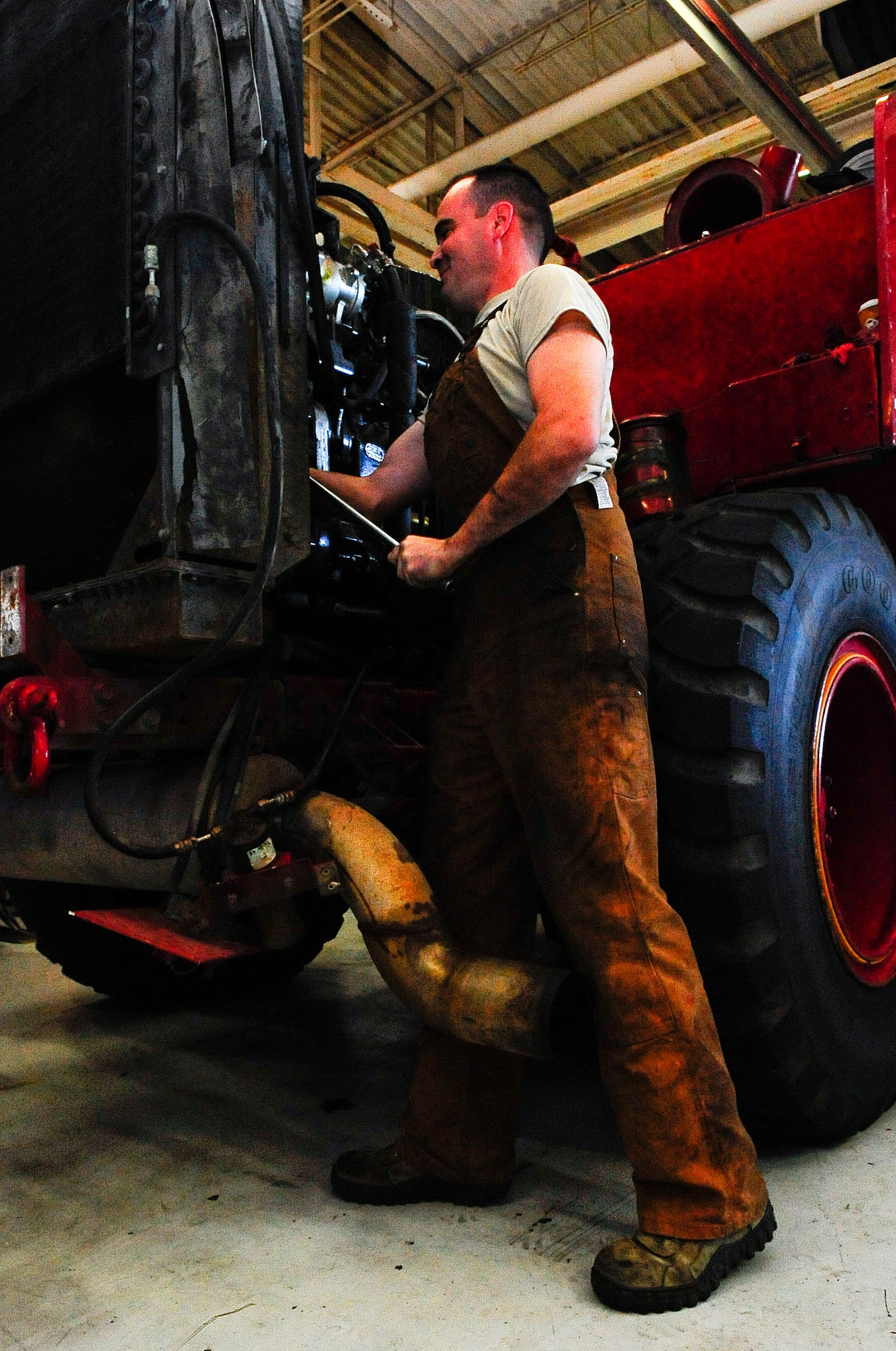 Staff Sgt. Nicholas Cawley, 1st Special Operations Logistics Readiness Squadron vehicle equipment journeyman, works on a fire truck at Hurlburt Filed, Fla., Jan. 21, 2015. The fire truck has been active since 1986, making it the oldest government vehicle on Hurlburt. (U.S. Air Force photo/Airman 1st Class Andrea Posey)