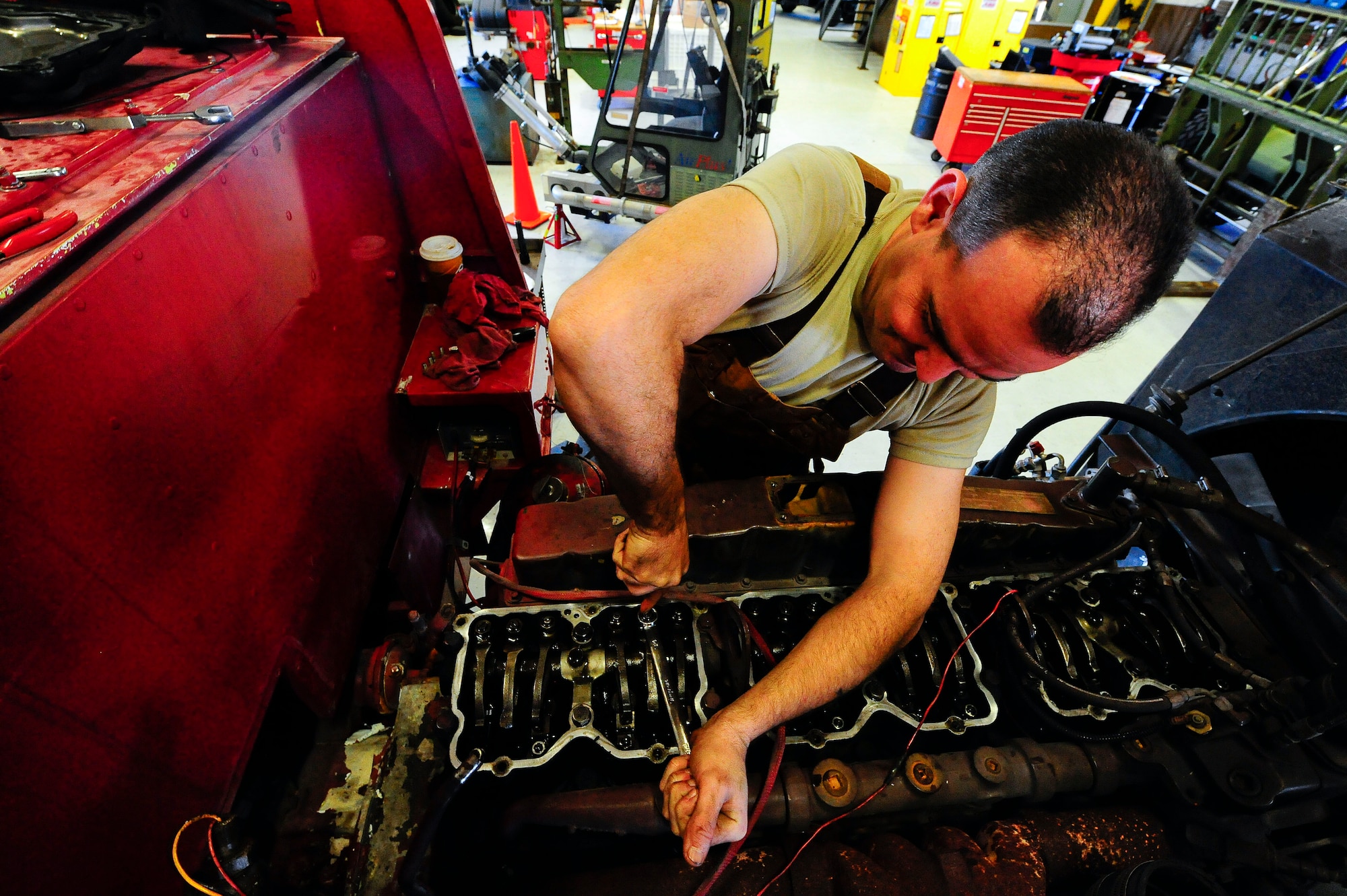 Staff Sgt. Nicholas Cawley, 1st Special Operation Logistics Readiness Squadron vehicle equipment journeyman, fixes the water pump on a fire truck at Hurlburt Filed, Fla., Jan. 21, 2015. Vehicles are brought to 1 SOLRS for maintenance and repair. (U.S. Air Force photo/Airman 1st Class Andrea Posey)