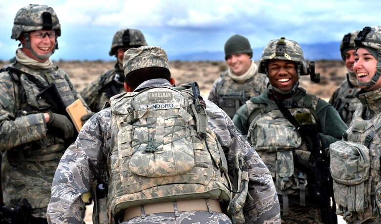 Tech. Sgt. Markus Mindoro, 99th Ground Combat Training Squadron integrated base defense course flight chief, jokes with students attending the last 99th GCTS Base Security Operations course at the Silver Flag Alpha Range Complex north of Las Vegas Dec. 17, 2014. The 99th GCTS is set to close in early 2015, and all Air Force tactical security forces-based training will be moved to the new Desert Defender Ground Combat Readiness Training Center at Fort Bliss, Texas. (U.S. Air Force photo by Tech. Sgt. Nadine Barclay/Released)
