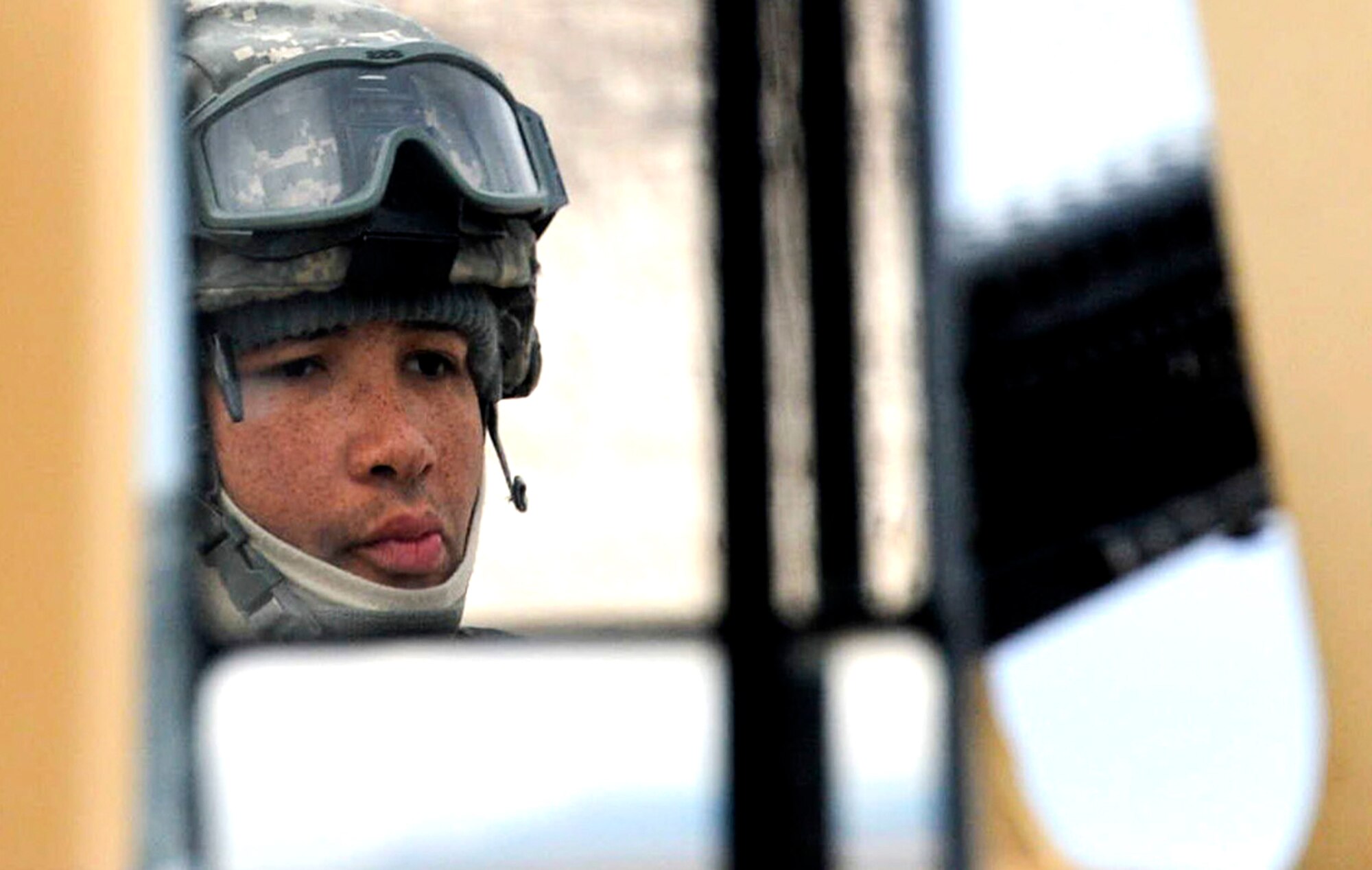 Senior Airman Eveny Wiggins, Base Security Operations course student, concentrates on materials being presented by the 99th Ground Combat Training Squadron cadre during a pre-evaluation training scenario at the Silver Flag Alpha Range Complex north of Las Vegas Dec. 17, 2014. Wiggins is assigned to the 512th Security Forces Squadron at Dover Air Force Base, Delaware, and he attended the 17-day course as part of his pre-deployment training. (U.S. Air Force photo by Tech. Sgt. Nadine Barclay/Released)
