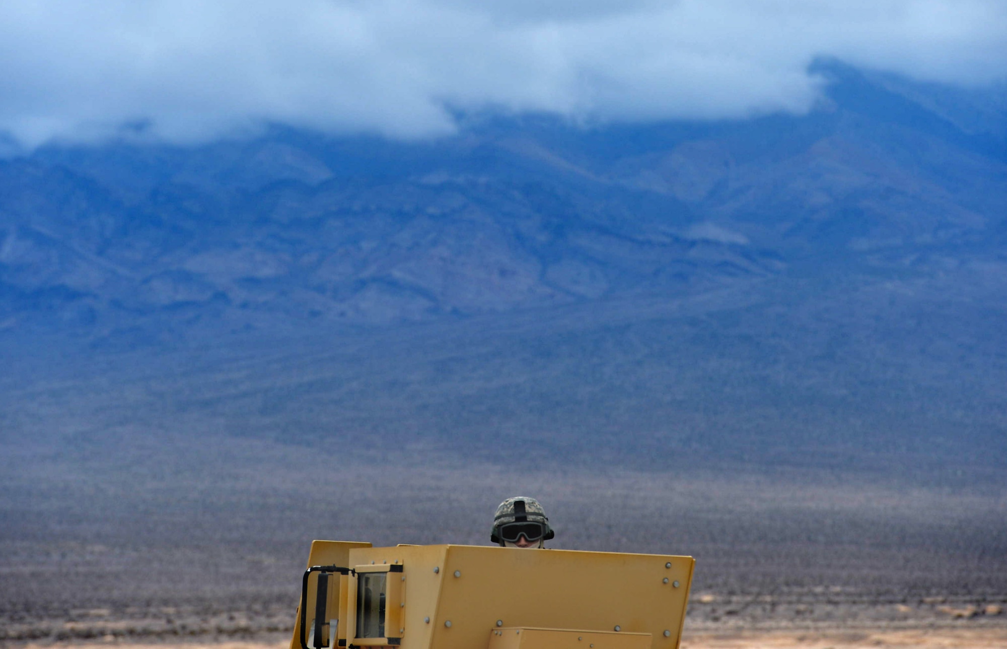 Senior Airman Luis Reyes, Base Security Operations course student from the 512th Security Forces Squadron at Dover Air Force Base, Delaware, waits for instructions during pre-evaluation training at the Silver Flag Alpha Range Complex north of Las Vegas Dec. 17, 2014. The 17-day course is designed to qualify Airmen to conduct Integrated Defense Operations within base boundaries. (U.S. Air Force photo by Tech. Sgt. Nadine Barclay/Released)
