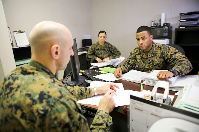 Master Sgt. Jason Spangenberg, 2nd Marine Aircraft Wing career planner, inspects the Marine Aviation Logistics Squadron 31 career planner Staff Sgt. Andrew Nelson during the commanding general inspection. CGIs review the unit in categories ranging from basic Marine Corps standards such as proper wear of uniforms, drill and physical fitness to standards specific to the unit.