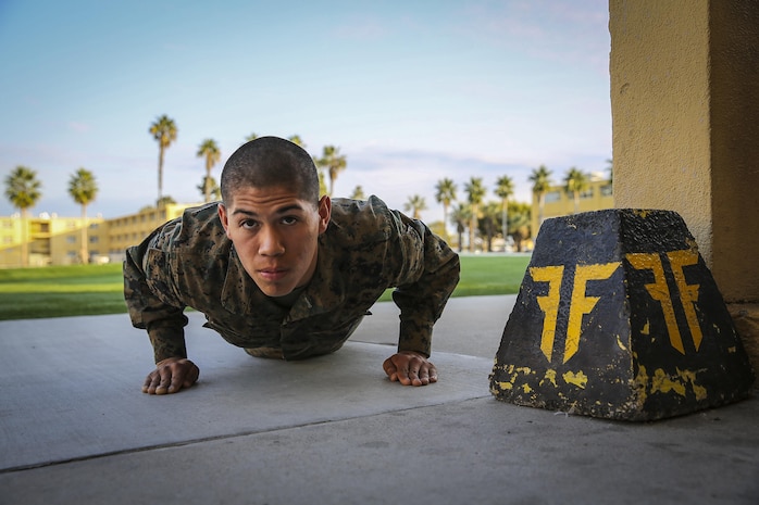 Private First Class Angel S. Ortiz, Platoon 2121, Fox Company, 2nd Recruit Training Battalion, performs push-ups at Marine Corps Recruit Depot San Diego, Jan. 8.  Ortiz took on the difficult task of squad leader and held on to the position throughout recruit training.  His senior drill instructor rewarded his efforts by meritoriously promoting him to the rank of private first class.