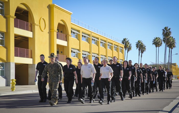 Sgt. Anthony S. Gomez, drill instructor, Support Battalion, leads Department of Defense employees in the Executive Leadership Development Program on their tour of the facilities at Marine Corps Recruit Depot San Diego, Jan. 6.  The ELDP class came to the depot to learn how Marines are made.