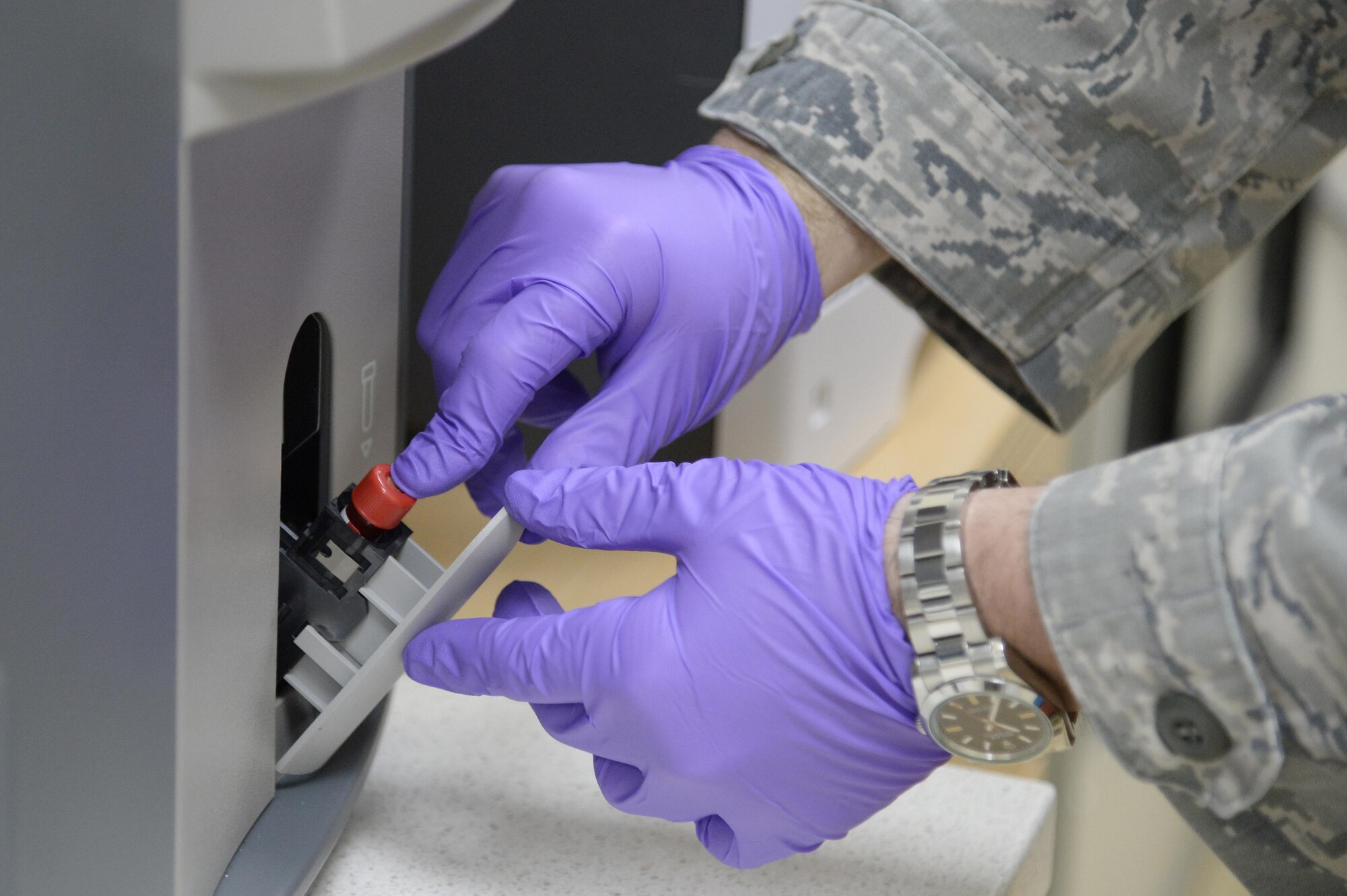 Staff Sgt. John, laboratory medical technician, puts a complete blood count sample in the Coulter AcT diff2 CBC machine at an undisclosed location in Southwest Asia Jan. 21, 2015. The machine will allow physicians with the Expeditionary Medical Group to diagnose and give a quick determination of whether or not the patient is having an infection. John is currently deployed from Moody Air Force Base, Ga., and is a native of Christiansburg, Va. (U.S. Air Force photo/Tech. Sgt. Marie Brown)