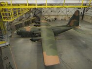 Airmen from the 62nd Maintenance Squadron spent more than two months repainting a C-130 Hercules in the Vietnam-era camouflage scheme.  The aircraft was painted for the McChord Air Museum and will be on display in the McChord Air Park in the near future. (Courtesy photo)